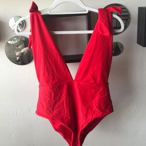 Low cut high rise one piece bathing suit